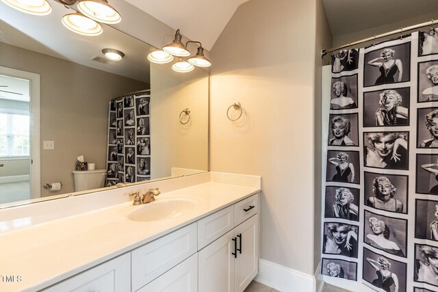 120 Gentle Rain Dr, Garner, NC 27529 - bathroom featuring vaulted ceiling, toilet, vanity, baseboards, and a shower with curtain