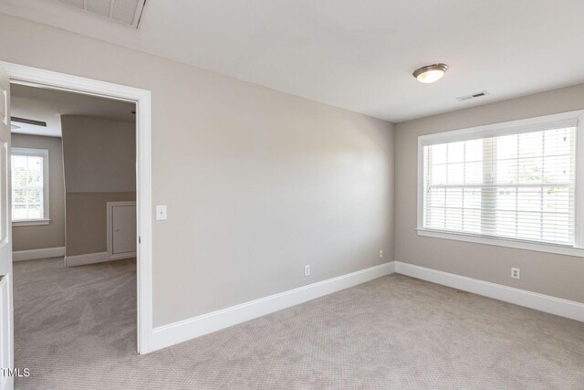 120 Gentle Rain Dr, Garner, NC 27529 - unfurnished room with light colored carpet and baseboards