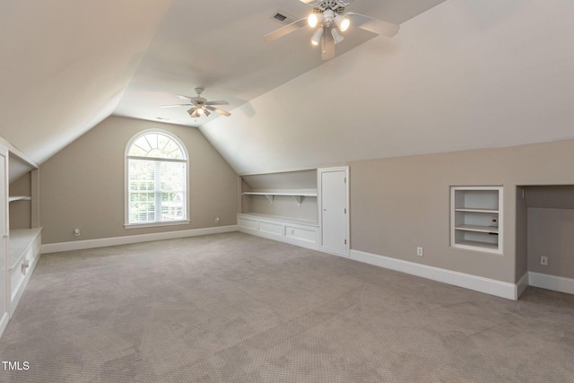 120 Gentle Rain Dr, Garner, NC 27529 - bonus room with built in shelves, a ceiling fan, light carpet, baseboards, and vaulted ceiling
