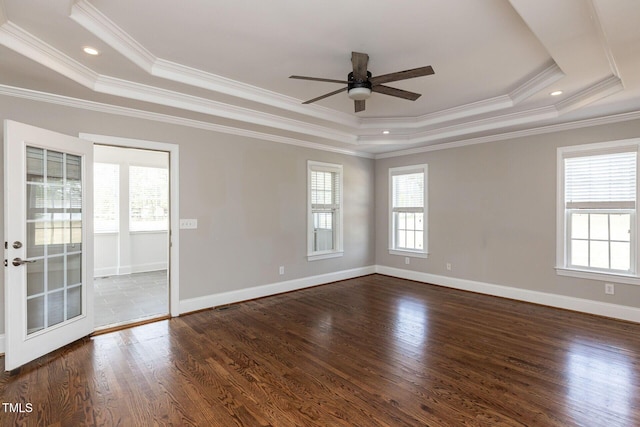 120 Gentle Rain Dr, Garner, NC 27529 - empty room featuring a tray ceiling, ceiling fan, dark wood-style flooring, ornamental molding, and baseboards