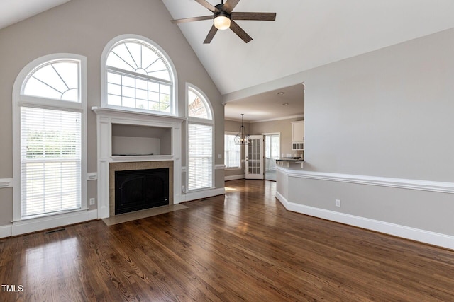 120 Gentle Rain Dr, Garner, NC 27529 - unfurnished living room with ceiling fan, dark wood-style floors, a fireplace, baseboards, and high vaulted ceiling