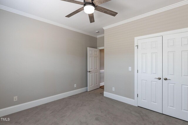 120 Gentle Rain Dr, Garner, NC 27529 - unfurnished bedroom featuring carpet flooring, crown molding, a closet, baseboards, and ceiling fan