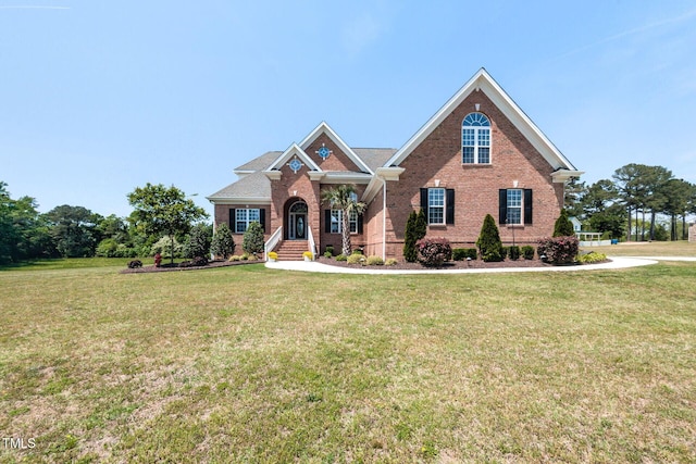 120 Gentle Rain Dr, Garner, NC 27529 - view of front of home with brick siding and a front yard