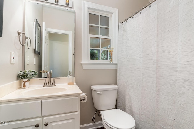 bathroom with toilet and vanity