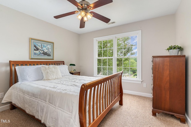 bedroom featuring carpet, baseboards, and ceiling fan