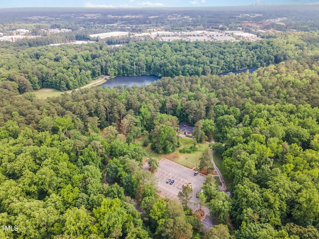 aerial view of a forest and a nearby body of water