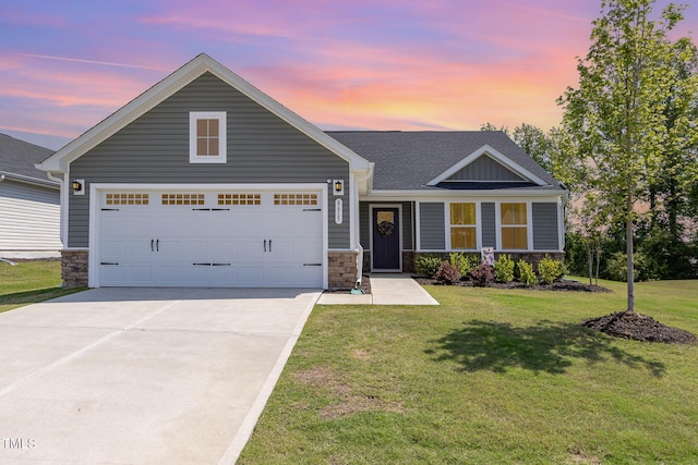 8615 Kenridge Ln, Fuquay Varina, NC 27526 - view of front facade with stone siding, concrete driveway, a lawn, and an attached garage