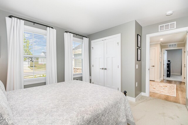8615 Kenridge Ln, Fuquay Varina, NC 27526 - bedroom with baseboards, a closet, and carpet