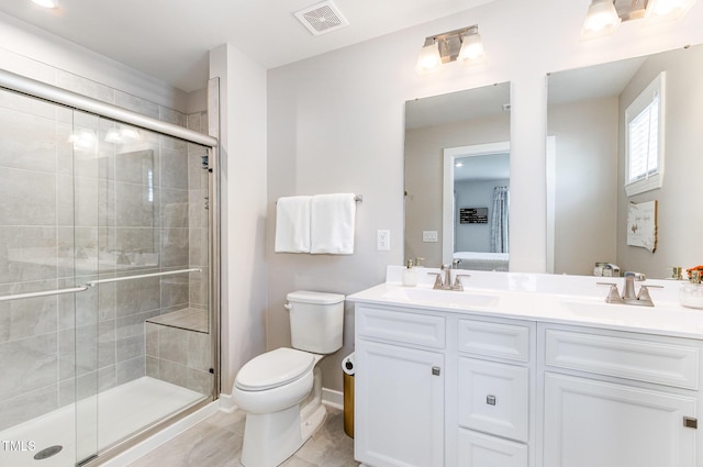 8615 Kenridge Ln, Fuquay Varina, NC 27526 - full bath with toilet, double vanity, a shower stall, and baseboards