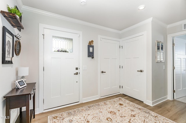 8615 Kenridge Ln, Fuquay Varina, NC 27526 - entrance foyer with light wood-type flooring, baseboards, crown molding, and recessed lighting