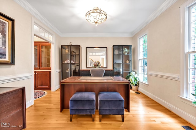 home office featuring light wood-type flooring and ornamental molding