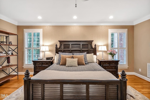 bedroom featuring wood finished floors, ornamental molding, baseboards, and recessed lighting