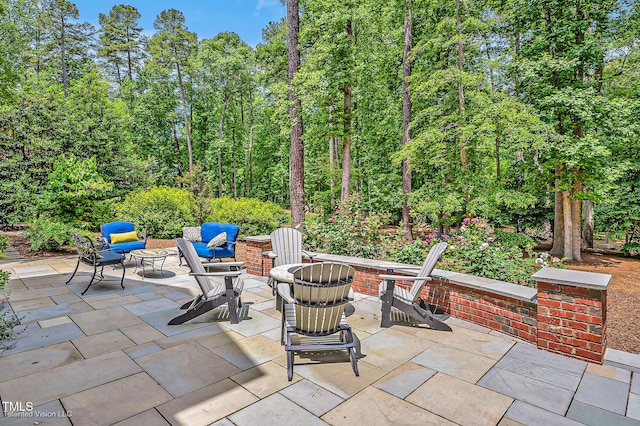 view of patio / terrace featuring a fire pit