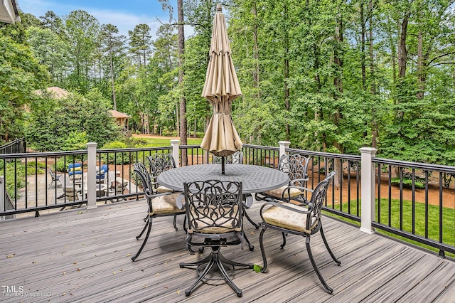 deck featuring outdoor dining area