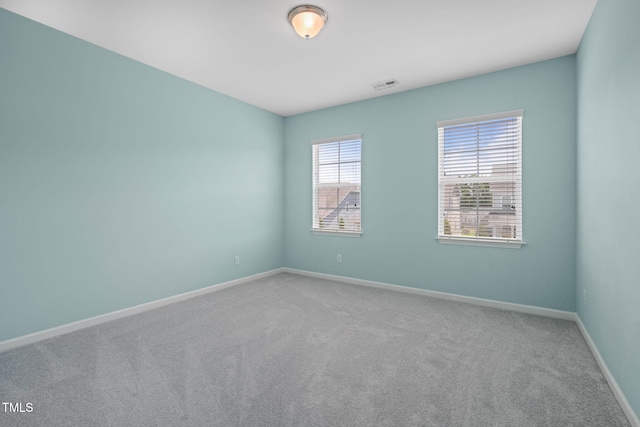 1013 Poppy Fields Ln, Wake Forest, NC 27587 - carpeted empty room with baseboards