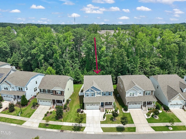 1013 Poppy Fields Ln, Wake Forest, NC 27587 - aerial perspective of suburban area with a forest
