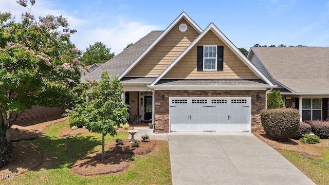 232 Shady Hollow Ln, Garner, NC 27529 - craftsman inspired home with driveway, a shingled roof, and stone siding