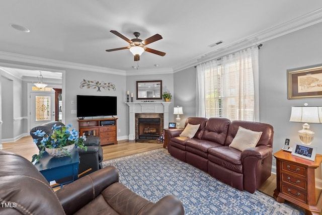 232 Shady Hollow Ln, Garner, NC 27529 - living room featuring wood finished floors, ceiling fan, ornamental molding, a fireplace, and baseboards