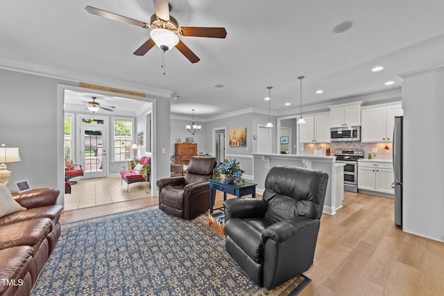 232 Shady Hollow Ln, Garner, NC 27529 - living room featuring ornamental molding, a ceiling fan, light wood-type flooring, recessed lighting, and a chandelier