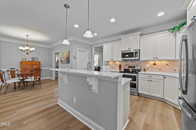 232 Shady Hollow Ln, Garner, NC 27529 - kitchen featuring appliances with stainless steel finishes, tasteful backsplash, white cabinetry, recessed lighting, and crown molding