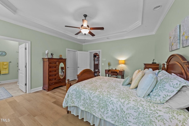 232 Shady Hollow Ln, Garner, NC 27529 - bedroom with a tray ceiling, light wood-style flooring, ornamental molding, baseboards, and ceiling fan