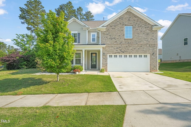 traditional-style home featuring brick siding, an attached garage, driveway, and a front lawn