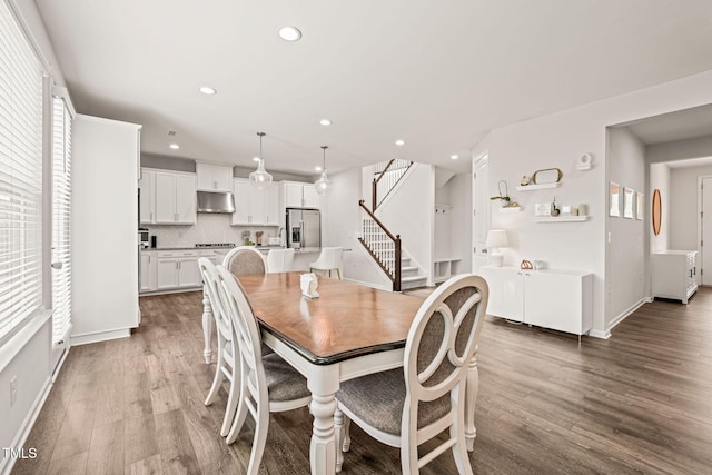 dining area with stairway, wood finished floors, recessed lighting, and baseboards
