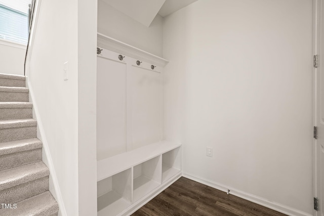 mudroom featuring dark wood-style floors and baseboards