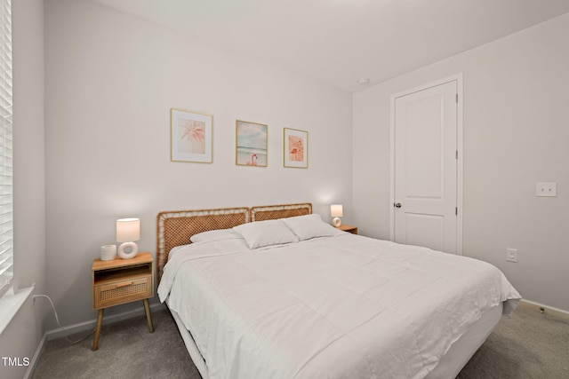 bedroom featuring carpet flooring and baseboards