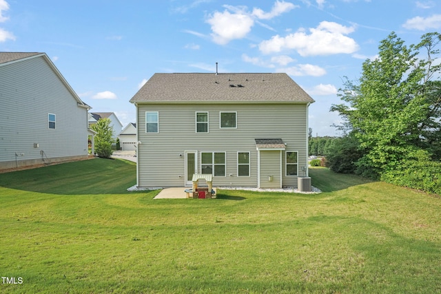 back of property with a patio, central AC unit, and a yard
