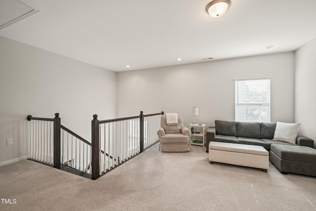 living room featuring attic access, carpet floors, recessed lighting, and baseboards