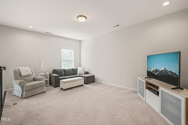 living room featuring carpet flooring, recessed lighting, and baseboards