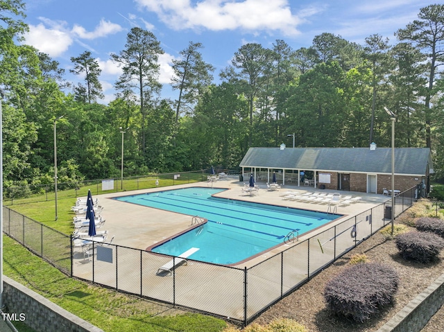 community pool with a patio area