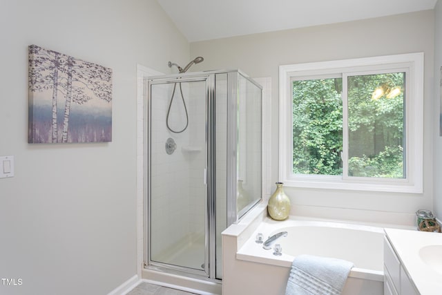 9305 Dominion Blvd, Raleigh, NC 27617 - bathroom featuring a stall shower, a garden tub, and vanity