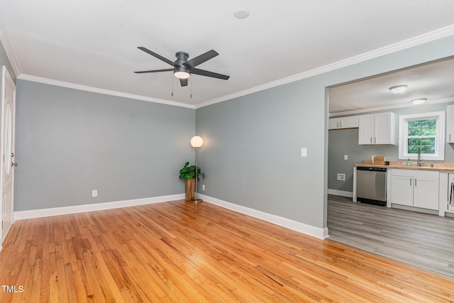 4420 W River Rd, Franklinton, NC 27525 - spare room with ornamental molding, a ceiling fan, light wood-style flooring, baseboards, and a sink