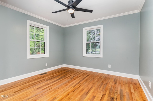 4420 W River Rd, Franklinton, NC 27525 - spare room with healthy amount of natural light, ornamental molding, hardwood / wood-style floors, and baseboards