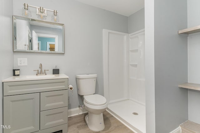 4420 W River Rd, Franklinton, NC 27525 - full bath with toilet, a shower, vanity, wood finished floors, and baseboards