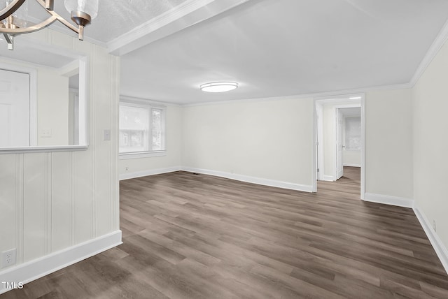 313 W Church St, Angier, NC 27501 - empty room featuring ornamental molding, dark wood-type flooring, and baseboards