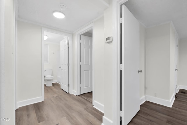 313 W Church St, Angier, NC 27501 - hallway featuring wood finished floors and baseboards
