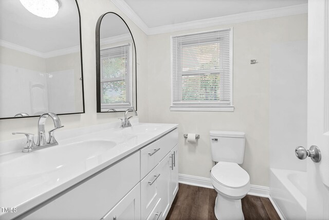 313 W Church St, Angier, NC 27501 - full bathroom with plenty of natural light, toilet, wood finished floors, baseboards, and ornamental molding