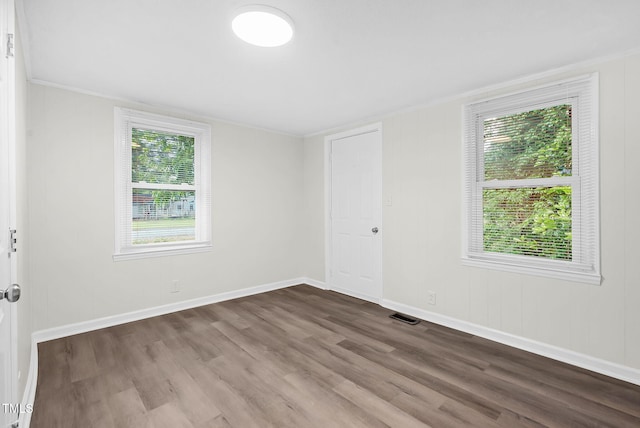 313 W Church St, Angier, NC 27501 - unfurnished room featuring dark wood-style floors, baseboards, and ornamental molding