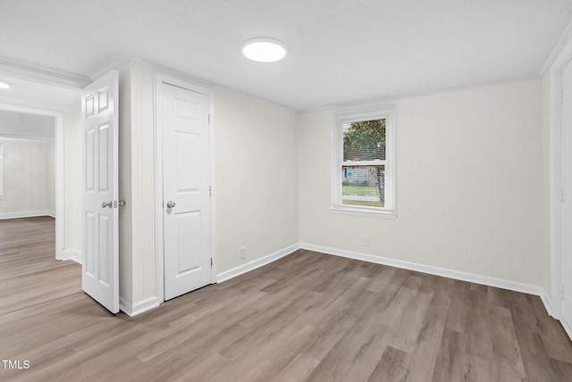 313 W Church St, Angier, NC 27501 - unfurnished bedroom featuring wood finished floors and baseboards