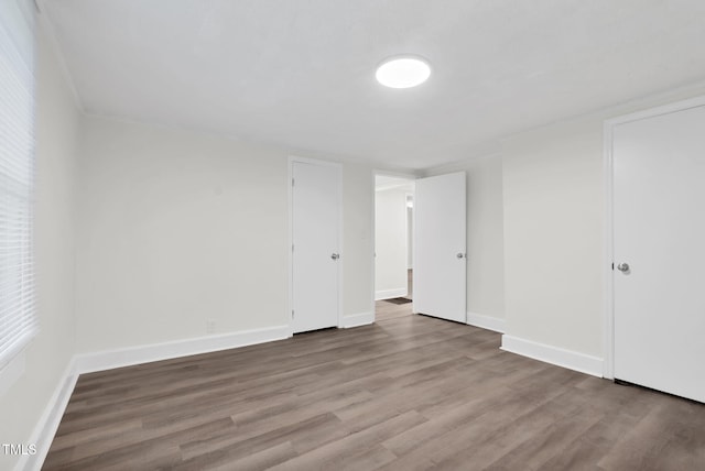 313 W Church St, Angier, NC 27501 - empty room featuring wood finished floors and baseboards