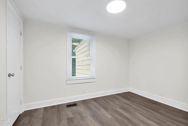 313 W Church St, Angier, NC 27501 - empty room featuring dark wood-style flooring and baseboards