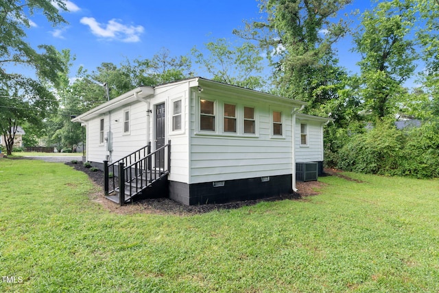 313 W Church St, Angier, NC 27501 - view of side of home featuring a lawn, central air condition unit, and crawl space