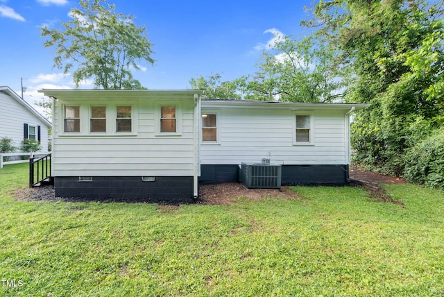 313 W Church St, Angier, NC 27501 - back of house with crawl space, central AC, and a yard
