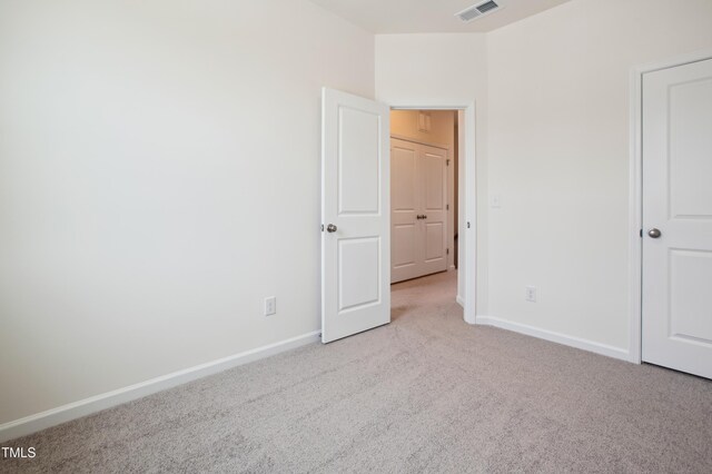 unfurnished bedroom with carpet and baseboards