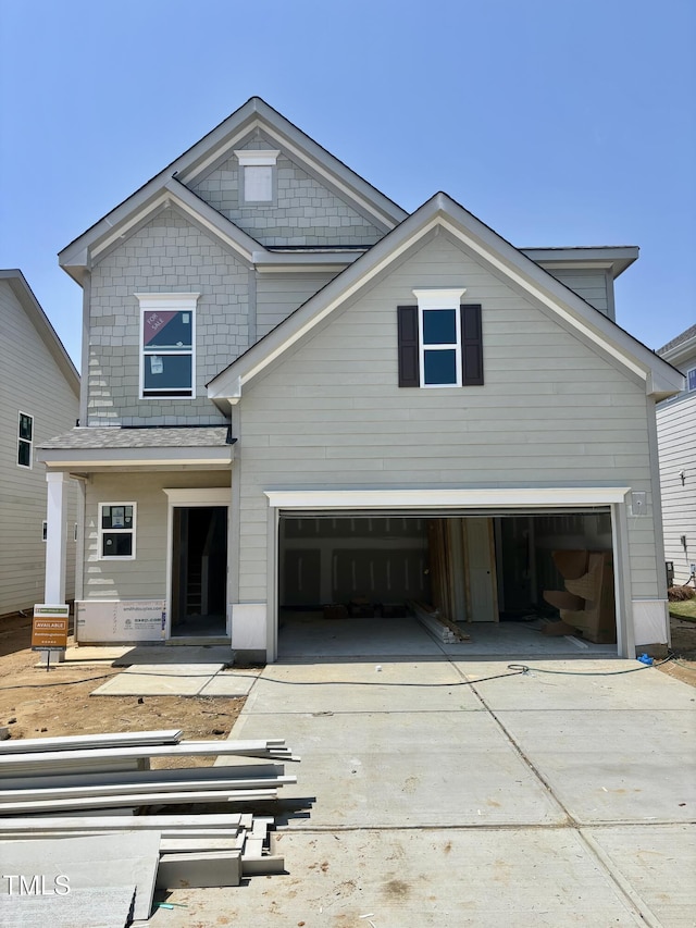 view of front of home with driveway and an attached garage