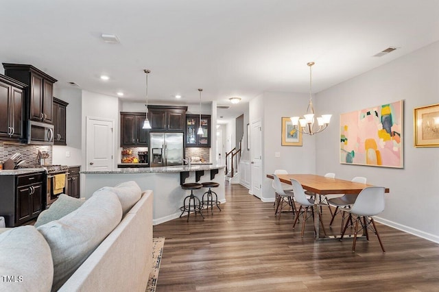 174 Walking Path Pl, Hillsborough, NC 27278 - dining space with recessed lighting, dark wood finished floors, a chandelier, baseboards, and stairs