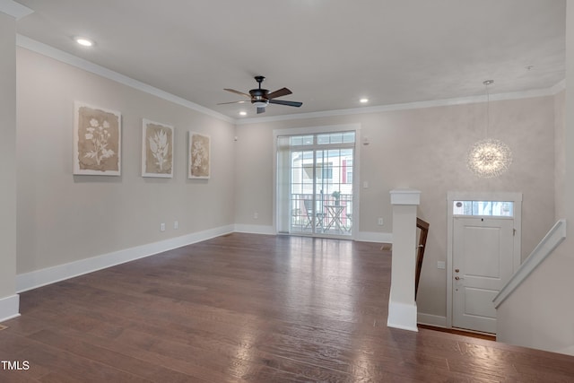 10330 Sablewood Dr Unit 104, Raleigh, NC 27617 - foyer featuring a ceiling fan, dark wood-type flooring, crown molding, recessed lighting, and a chandelier
